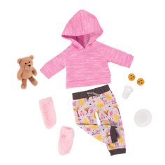 a teddy bear is sitting next to a set of clothing and accessories for a doll