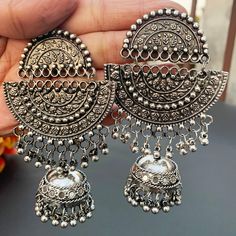 Add charm to your outfits in these long and subtle oxidized earrings.These go well on any face types and look great with all the outfits. Silver Earrings Indian, Afghani Earrings, Navratri Ideas, Vintage Indian Jewelry, Face Types, Oxidized Earrings, Oxidized Silver Earrings, Oxidised Silver Jewelry, Pretty Jewelry Necklaces