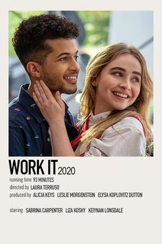 a man and woman are smiling together in front of a poster that says work it