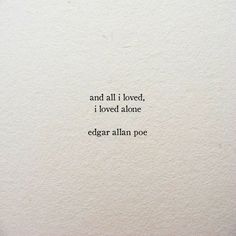 an old typewriter with the words and all i loved, i loved atone edgar allen poe