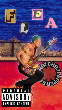 a man with green hair and tattoos playing an electric guitar in front of the ocean