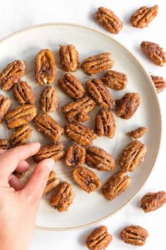 a plate with candied pecans on it and the title reads, candyish net