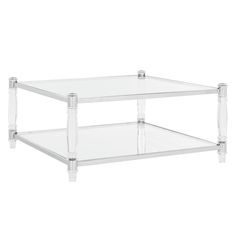 an acrylic coffee table with two clear shelves on the bottom and one shelf below it