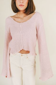 Get cozy in our For The Best Sweater - a playful pale pink boucle knit with exposed seams and lettuce edging. The relaxed fit and bell sleeves add a touch of quirk to this must-have piece. Stay stylish and comfy all season long! Details Boucle knit fabrication Exposed seams Bell sleeve Drop shoulder Lettuce edging Double V-neckline Sizing Approximate measurements: SIZE LENGTH BUST Small 21” 36” Medium 21” 38” Large 21” 40” Fabric has stretch Model is 5’8” wearing small Material 45% Acrylic 44% N Soft Pink Sweater Outfit, Girly Fall Outfits, Pink Sweater Outfit, Blush Pink Sweater, Church Fits, Boucle Knit, Light Pink Sweaters, Matching Sets Outfit, Exposed Seams