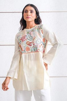 Ivory tunic top featuring multi-color thread embroidery on the yoke in abstract pattern. - Aza Fashions Tunic Tops Pattern, Spin Wheel, Ivory Tops, Thread Embroidery, Women Tunic Tops, Top For Women, Online Tops, Embroidered Silk, Top Pattern