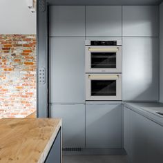 two ovens are built into the wall in this kitchen