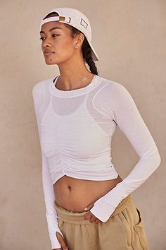 The perfect layer for every activity featured in a moves-with-you silhouette and long sleeve design with ruched bust detail for a forever flattering essential. * Crew neckline * Curved bottom hem * Soft, stretchy fit * Thumbholes in sleeves | Tempo Ruched Long Sleeve Top by FP Movement at Free People, White, XS Free People Activewear, Long Sleeve Design, New Today, Fp Movement, New Tops, Black Fits, Boho Clothing, Sleeve Designs, White Long Sleeve