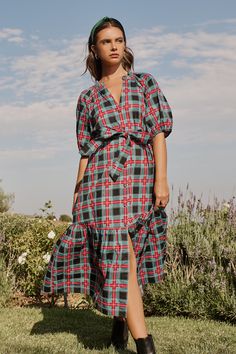 Get a sweet look for an evening out with the Winston Plaid Wynette Tiered Midi Dress. Voluminous puff sleeves highlight a split neckline that leads to a functional button front. A tie sash wraps around the waist, adding shape to a single tier midi skirt. Wear it with boots or heels for a perfect look. - Split neck- Button front- Tie belt- Tiered- Color: Multi PlaidSize + Fit - Model is 5'11" and wearing size XS- Measurements taken from size S - Chest: 19 3/4"- Length: 49" Fabric Self: 100% Cotto Tiered Midi Skirt, Tiered Midi Dress, I Feel Pretty, Plaid Dress, Tie Belt, Cotton Style, Puff Sleeves, Pink And Green, Puff Sleeve