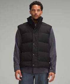 Peak Cold-Weather Comfort Has Arrived. Take Winter By Storm In This Wonderfully Warm Puffer Vest That Is Insulated With Plush Channels Of 600-Fill-Power Down. Designed For Casual. Classic Fit Falls Away From Your Body With Room For Layering. Zippered Exterior Pockets With A Hidden Phone Sleeve. Interior Pockets Hold The Essentials. | Wunder Puff 600-Down-Fill Vest Tech Canvas Puff Vest, Black Puffer Vest, Men's Coats & Jackets, Puffer Vest, Men's Coats And Jackets, Short Tops, Mens Coats, Tank Shirt, Vest Jacket