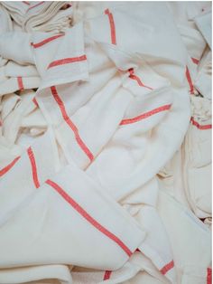 white and red striped fabric laying on top of each other