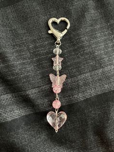 This is a handmade keychain or phonecharm with a cute heart attachment. Merritt Island, Handmade Keychain, Jewelry Accessories Ideas, Kawaii Accessories, Heart Keychain, Charm Keychain, Cute Heart, Diy Clay Crafts, Car Keychain