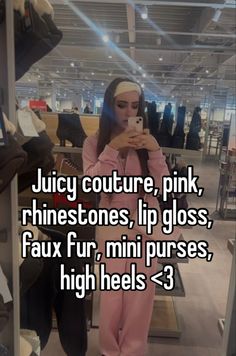 a woman taking a selfie in front of a mirror with the capt juicy couture