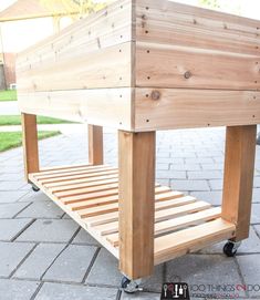 a wooden bench sitting on top of a sidewalk