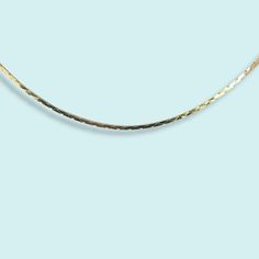 A sleek serpentine chain. Perfect for layering. Metal: 14kt gold plating over brass Size: 18" Chain Spring Clasp Made in the USA