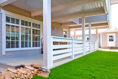 the front porch is covered with grass and wood