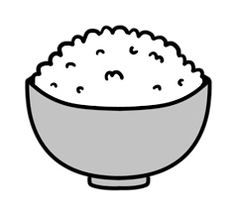 a bowl filled with rice sitting on top of a table