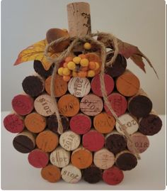 a wine cork fall decoration made to look like a pumpkin