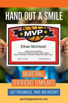 a person holding up a basketball certificate with the words,'hand out a smile '