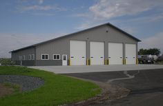 an industrial building with two garages on each side