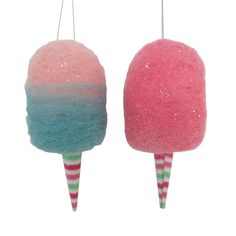 two lollipops hanging from strings on white background