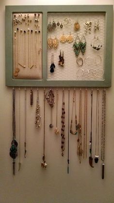 a wall mounted jewelry display in a room