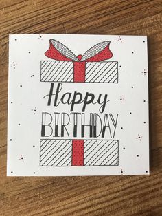 a card with the words happy birthday written on it and a red ribbon tied around it