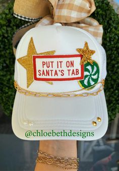 Please not that we do not always have these patches on hand. We order them from suppliers that custom make the patches.  Hat chains are removable with clasps on each end. They can be bought separate or with the hat. Please allow up to 2 weeks for this hat to ship as this is a pre-order item. $10-$12 chain options do not include hats. $40-$50 bling hat options do include trucker hat and bling as pictured. For clarification when purchasing: If you purchase one of the hat chain options, this is ind Christmas Trucker Hat, Hat Chain, Winter Dinners, Xmas Sweaters, Bling Hat, White Trucker Hat, Hat Bar, Custom Trucker Hats, Ugly Xmas Sweater