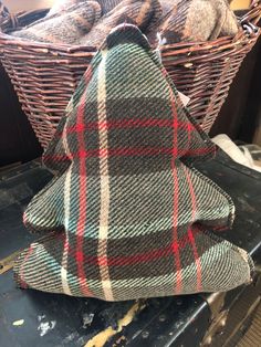 a plaid christmas tree sitting on top of a table