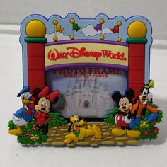 Authentic Disney Parks Walt Disney World Mickey & Pals Gate Photo Frame 2x3 Magnet Walt Disney World Gate Way Entrance Display Represents The One In Orlando Florida Brand New Photo Frame Self Standing Or Magnetic Features The Famous Walt Disney World Property Gate And Mickey And His Pals Minnie, Pluto, Goofy And Donald Duck Size" 4 1/2" (W) X 4" (H) Pvc Photo Size Holds 2" X 3" Disney Photo Frames, Birthday At Disney, Disney Picture Frames, Mickey Mouse Bedding, New Photo Frame, Mermaid Pictures, Walt Disney World Vacations, Family Project, Field Day