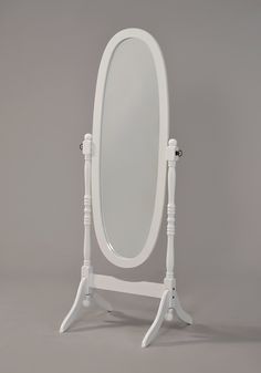 a white stand with a mirror on it