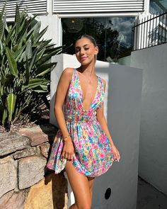 Floral Mini Dress We have the perfect mini dress for you! Pop on this show stopping fit with some heels and be ready to turn heads - this dress is gorg! Vacation Floral Print Mini Dress, Floral Print Mini Hem Vacation Dresses, Vacation Mini Hem Dress With Floral Print, Floral Print Mini Hem Sundress, Floral Print Sundress With Mini Hem, Flirty Mini Beach Dress, Flirty Mini Dress With Mini Hem For Day Out, Flirty Mini Dress For The Beach, Summer Mini Dress With Floral Print