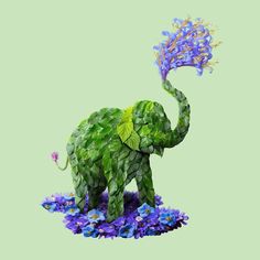 an elephant made out of leaves and flowers