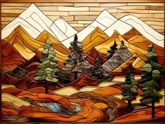 a stained glass window with mountains and trees