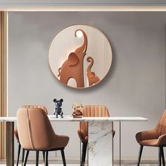 a dining room table with chairs and a round mirror on the wall above it that has an elephant sculpture