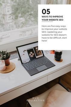 a white desk with a laptop on it next to a potted plant and window