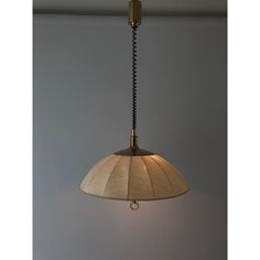 a lamp hanging from the ceiling in a room