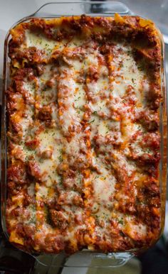 a casserole dish filled with meat and cheese