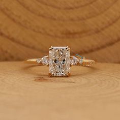 an oval cut diamond ring with three side stones