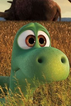 the good dinosaur is sitting in tall grass