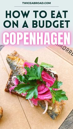 a close up of a piece of food on a table with text overlay reading how to eat on a budget copenhagenhagen