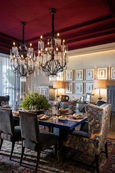 an elegant dining room with chandelier and chairs