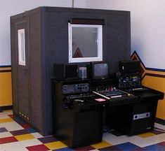 a room with several electronic equipment on the floor