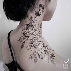 a woman's neck with flowers on it and the bottom part of her neck