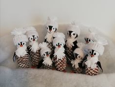 a group of small pine cones with penguins on them