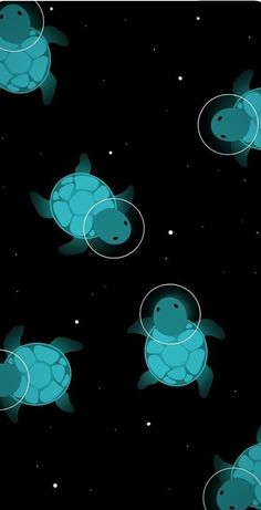 a group of sea turtles swimming in the ocean at night with bubbles floating around them