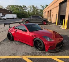 a red sports car parked in front of a building