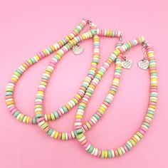 This Classic Rainbow Faux Candy Choker is the perfect cute charm jewelry to add a kawaii and fun finishing touch to any outfit. These faux candy necklaces come in custom lengths from choker to a necklace. This handmade jewelry piece makes the perfect gift for any woman in your like who is a cute charm jewelry lover or even your best friend! Handmade and comes in a free pink gift box.  Visit My Shop For More: https://etsy.com/shop/fatallyfeminine Details & Measurements:     -High quality Rainbow candy color beads     -Silver Finish Components     -Handmade     -A fun and cheery piece great for everyday wear     -Choose your perfect length from 3 options: 15" , 17", 20" (all necklaces are slightly adjustable)     -Finished off with a Fatally Feminine Designs signature heart charm *(Listing i Kawaii Birthday, Birthday Gift For Best Friend, Pink Gift Box, Candy Necklaces, Rainbow Candy, Length Necklace, Birthday Gifts For Best Friend, Ring Pendant Necklace, Cute Charms