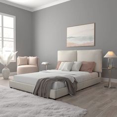 a bedroom with gray walls and white furniture