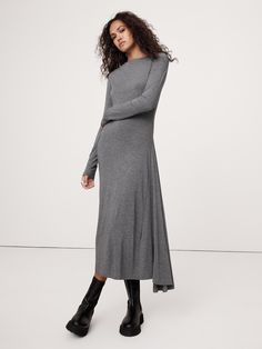 This asymmetric midi dress is cut in our signature wool-blend jersey, selected for its lightweight warmth and buttery handfeel.  Here, we employ extra-length in the sleeves for a ruched effect and a paneled construction to increase the sweep of its skirt and achieve a handkerchief-style hem.  Fit & flare.  Boat neck.  Pull-on design.  Fully lined.  Fit & flare.  Long sleeves.  Midi length.  Model: Size S, 5'10" (178cm).