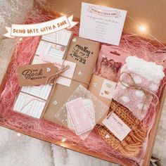 a box filled with lots of different items on top of a white carpeted floor